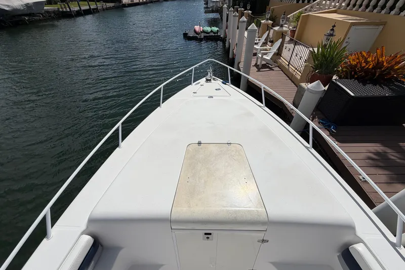 Slide: The Image of 2008 Donzi 29 ZF Cuddy boat docked by waterfront patio. - 19