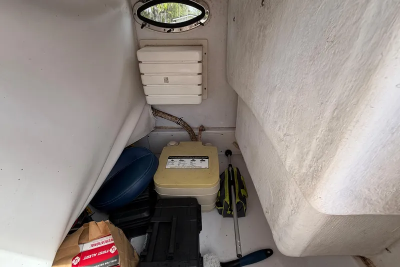 Slide: The Image of Interior of 2008 Donzi 29 ZF Cuddy boat with storage and equipment. - 23