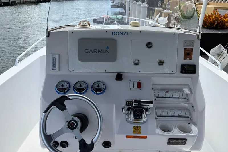 Slide: The Image of 2008 Donzi 29 ZF Cuddy boat dashboard with Garmin navigation system. - 9