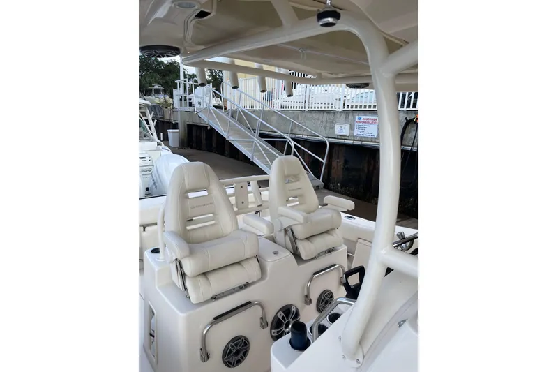Slide: The Image of 2023 Grady-White Canyon 306 boat interior with plush seating and modern design. - 11