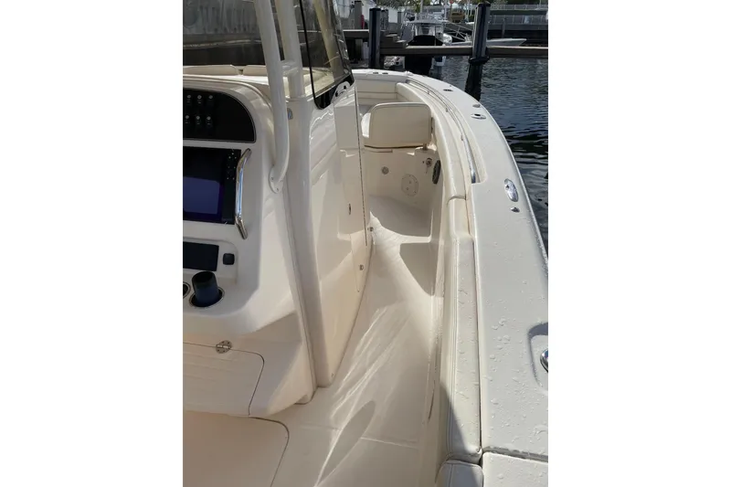 Slide: The Image of 2023 Grady-White Canyon 306 boat interior, featuring sleek design and modern controls. - 12
