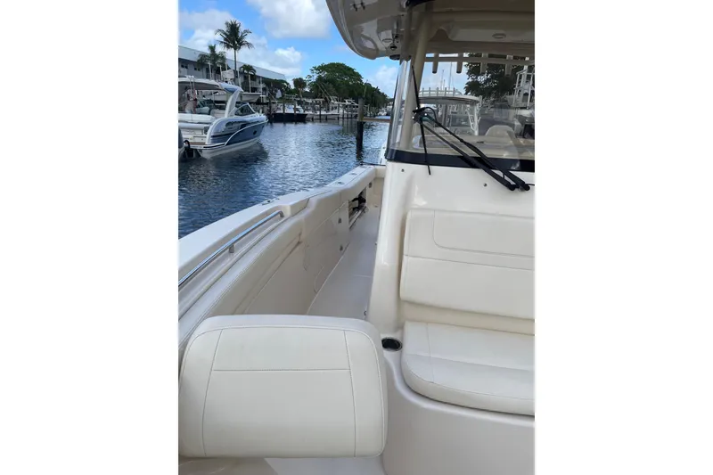 Slide: The Image of 2023 Grady-White Canyon 306 boat interior with waterfront view. - 17