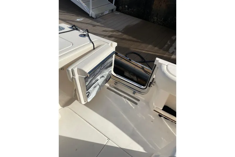 Slide: The Image of 2023 Grady-White Canyon 306 boat interior with foldable seat and storage area. - 18