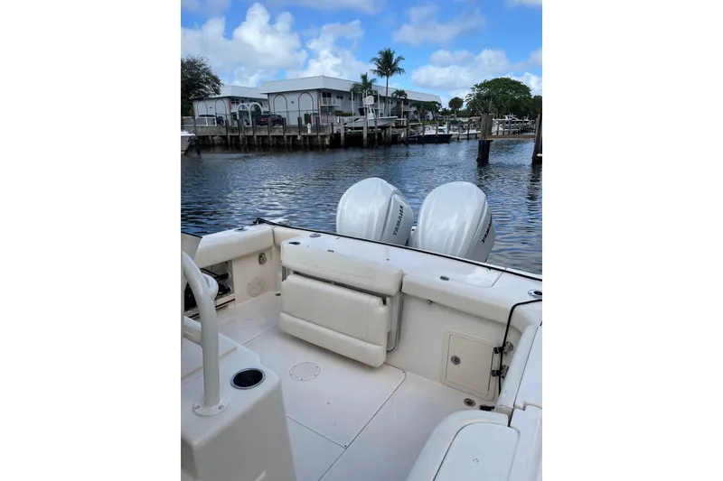 Slide: The Image of 2023 Grady-White Canyon 306 boat with Yamaha engines docked by waterfront. - 20