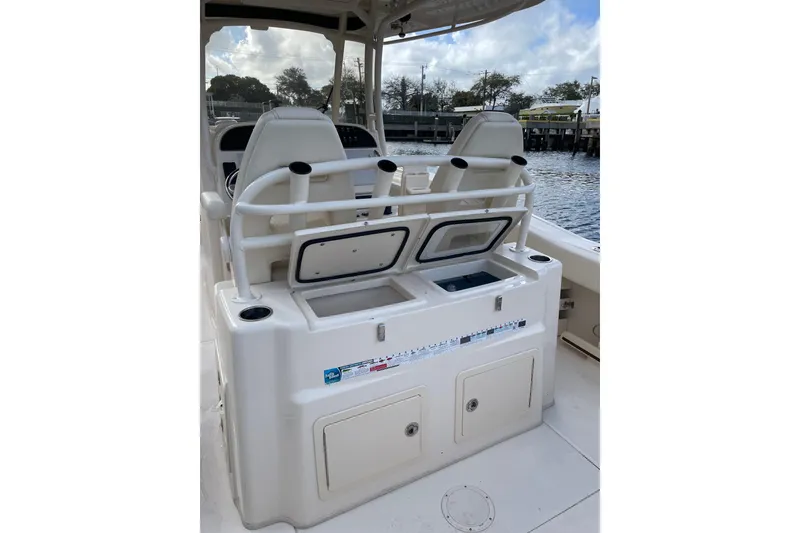 Slide: The Image of 2023 Grady-White Canyon 306 boat interior with seating and storage compartments. - 7