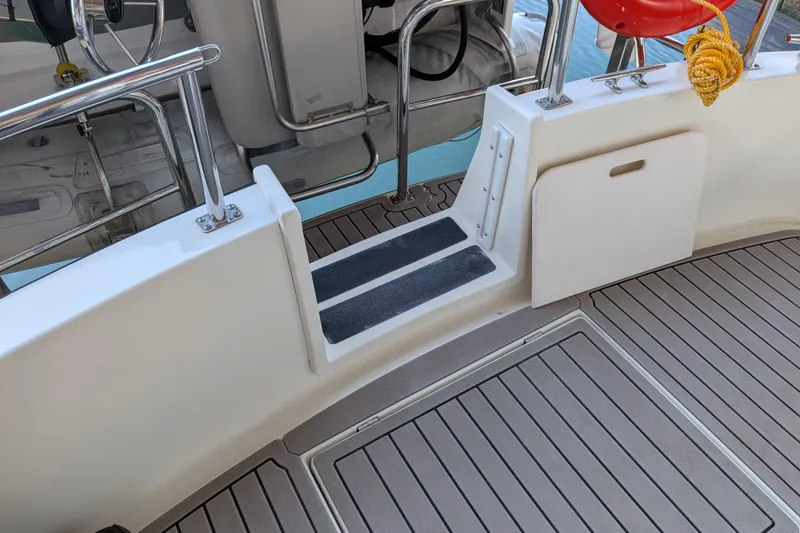 Slide: The Image of Nordic Tug 32 (2002) deck with non-slip steps and safety railings. - 20