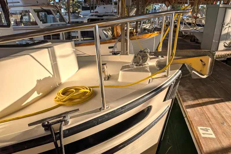 Slide: The Image of Nordic Tug 32 (2002) docked, featuring deck details and mooring equipment. - 21