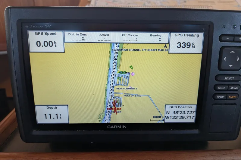 Slide: The Image of Garmin GPS display on 2002 Nordic Tug 32, showing navigation details and coordinates. - 61
