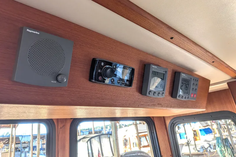 Slide: The Image of Control panel of a 2002 Nordic Tug 32 with Raymarine instruments. - 63