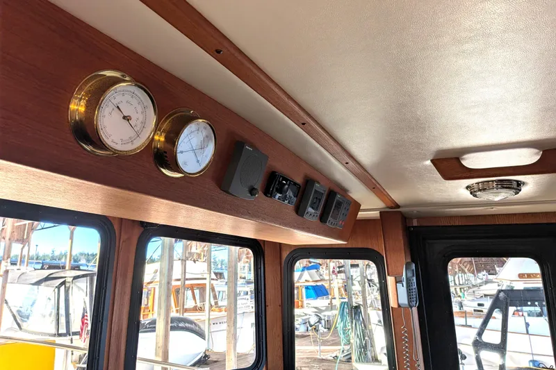 Slide: The Image of Interior of a 2002 Nordic Tug 32 with gauges and controls. - 64