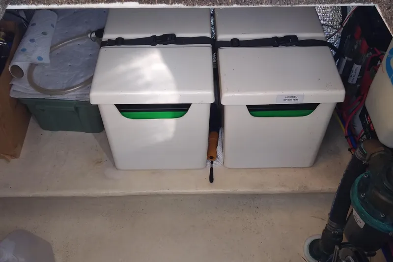 Slide: The Image of Storage compartment in a 2002 Nordic Tug 32 with secured containers and equipment. - 75