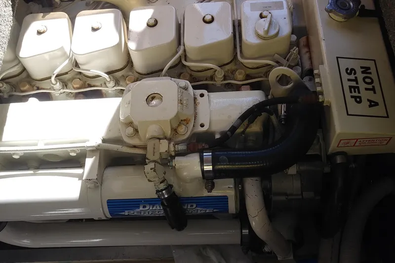 Slide: The Image of Engine compartment of a 2002 Nordic Tug 32 with visible components and "Not a Step" label. - 76