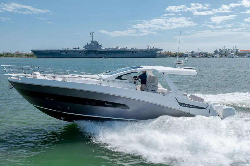 The Image of 2019 Azimut Verve 40 yacht cruising on water with a large ship in the background. - 0