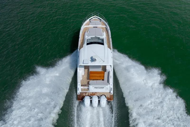 Slide: The Image of Aerial view of 2019 Azimut Verve 40 yacht cruising on green water. - 10