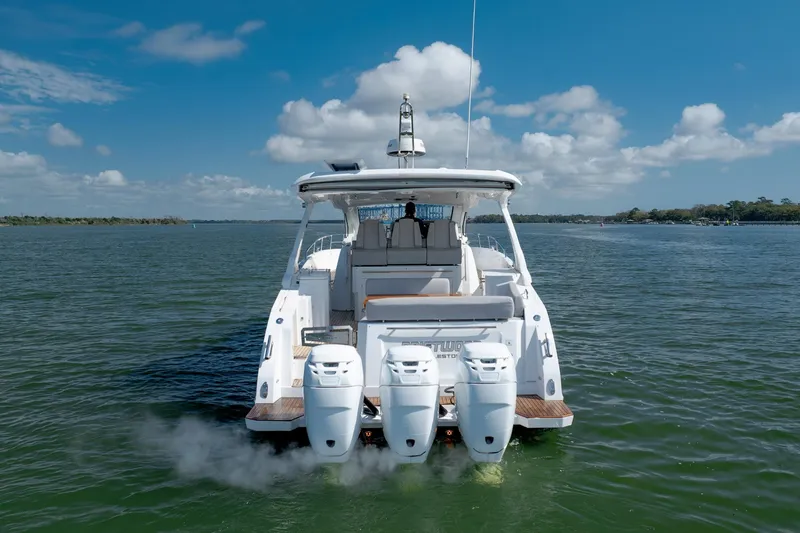 Slide: The Image of 2019 Azimut Verve 40 yacht on open water, rear view with triple engines. - 17