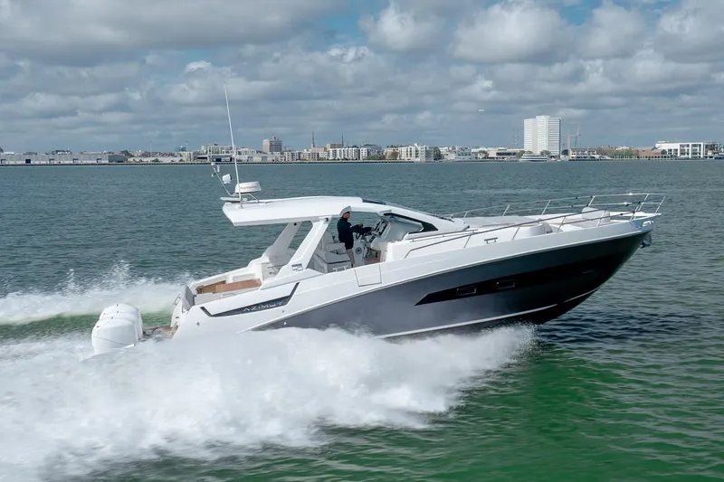 Slide: The Image of 2019 Azimut Verve 40 yacht cruising on open water under a cloudy sky. - 2