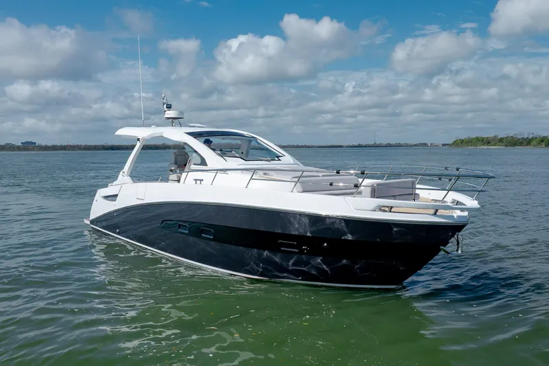 Slide: The Image of 2019 Azimut Verve 40 yacht on calm water under a partly cloudy sky. - 22