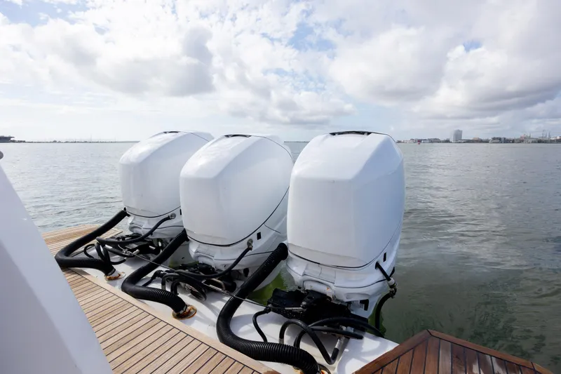 Slide: The Image of Triple outboard engines on 2019 Azimut Verve 40 yacht, docked on calm waters. - 28