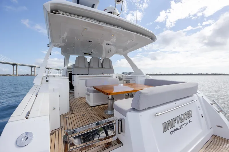 Slide: The Image of 2019 Azimut Verve 40 yacht with spacious deck and seating, cruising on calm waters. - 29