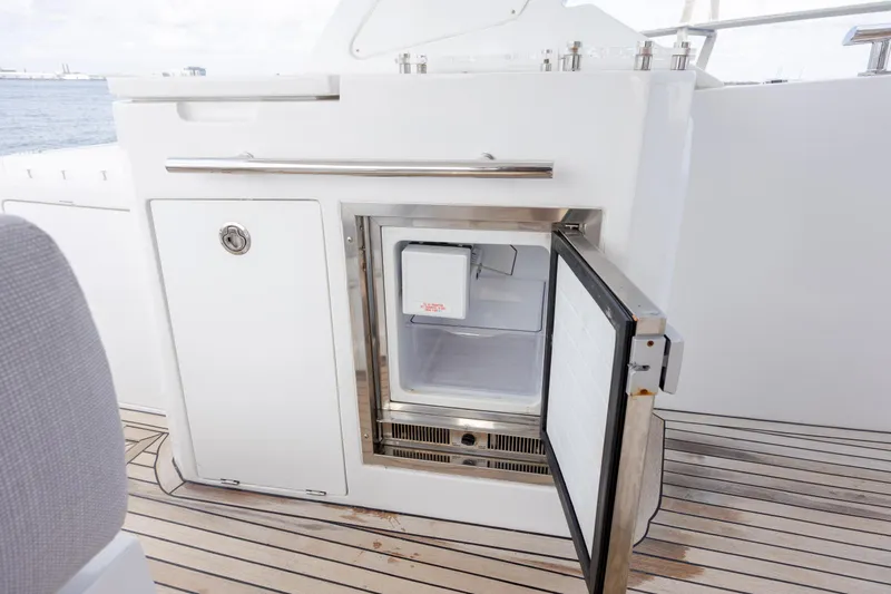 Slide: The Image of Open mini fridge on 2019 Azimut Verve 40 yacht deck, showcasing sleek design. - 37