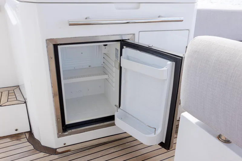 Slide: The Image of Open mini fridge on 2019 Azimut Verve 40 yacht with wooden deck flooring. - 40