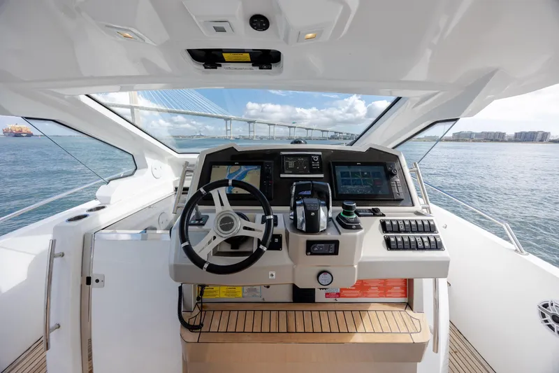 Slide: The Image of Cockpit view of 2019 Azimut Verve 40 yacht with navigation controls and ocean backdrop. - 44