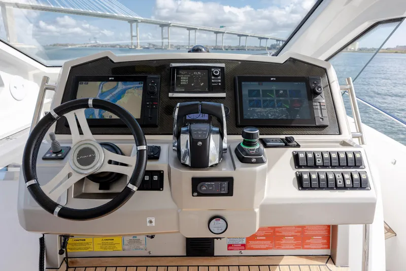 Slide: The Image of Helm of 2019 Azimut Verve 40 yacht with advanced navigation controls and displays. - 45