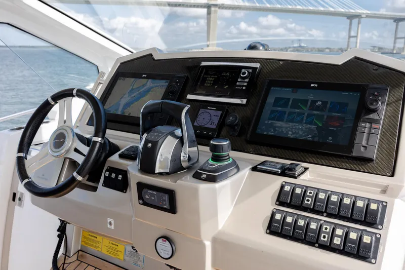 Slide: The Image of Cockpit of 2019 Azimut Verve 40 yacht with advanced navigation controls and displays. - 46