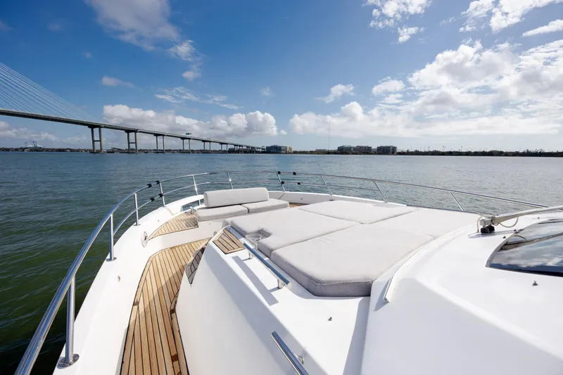 Slide: The Image of 2019 Azimut Verve 40 yacht with spacious deck, scenic bridge view, and clear blue sky. - 52
