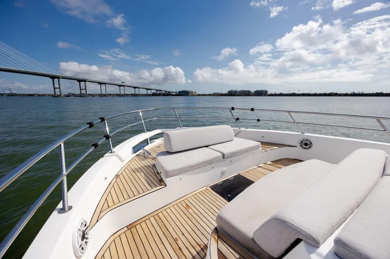 Slide: The Image of 2019 Azimut Verve 40 yacht deck with scenic water and bridge view. - 53
