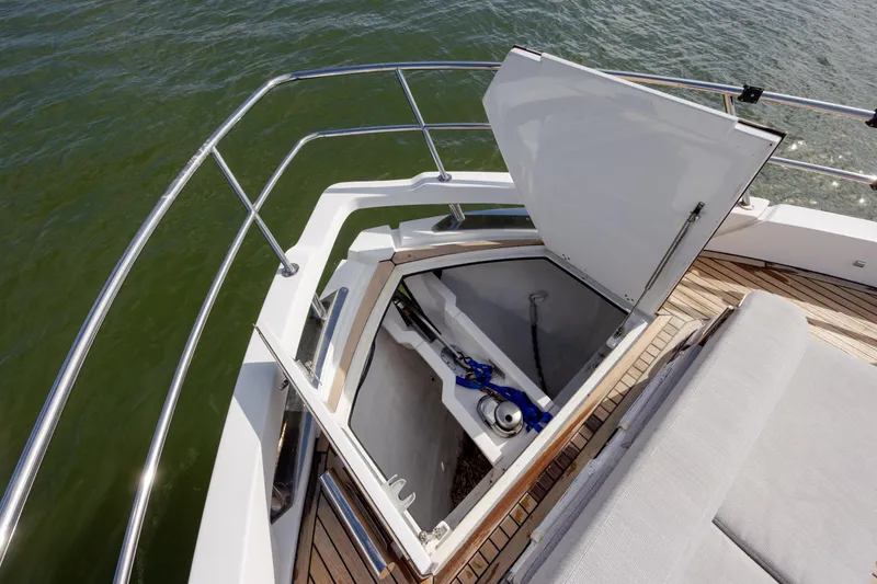 Slide: The Image of 2019 Azimut Verve 40 yacht anchor compartment with open hatch, showing storage details. - 57