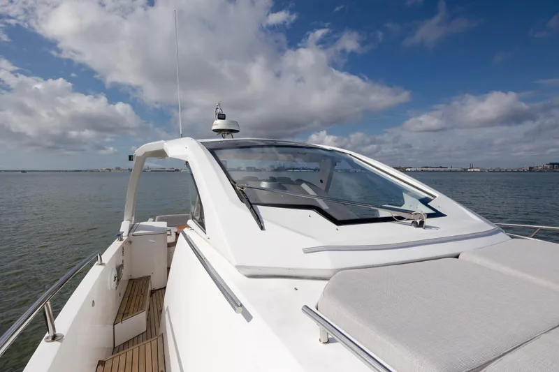 Slide: The Image of 2019 Azimut Verve 40 yacht on calm water under a partly cloudy sky. - 58