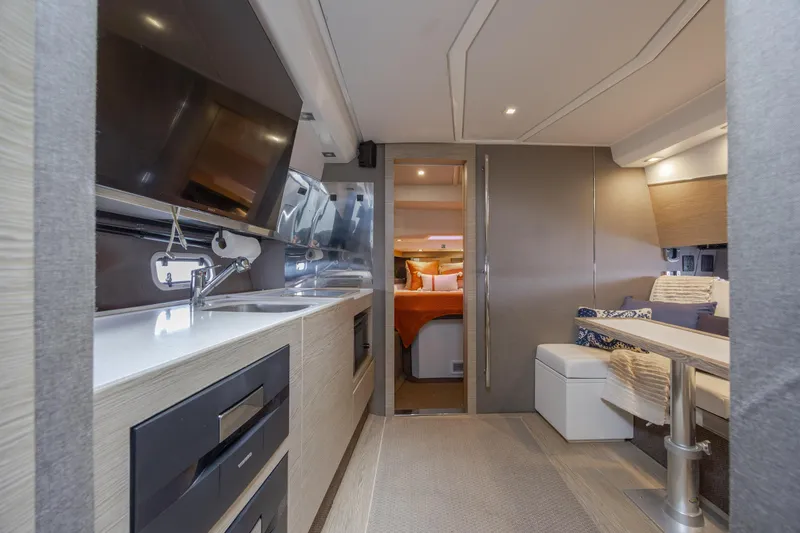 Slide: The Image of Luxurious interior of 2019 Azimut Verve 40 yacht with modern kitchen and cozy seating area. - 61