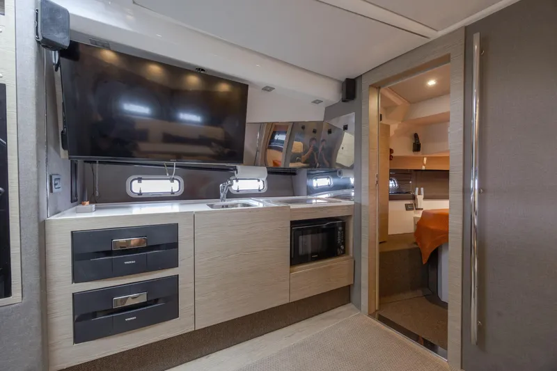 Slide: The Image of Luxurious interior of 2019 Azimut Verve 40 yacht with modern kitchen and TV. - 66