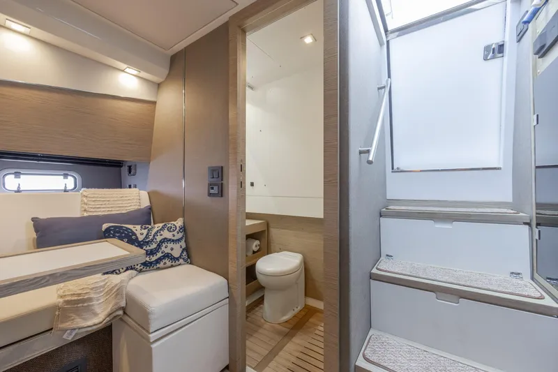 Slide: The Image of Interior of 2019 Azimut Verve 40 yacht featuring cozy seating and modern bathroom. - 67