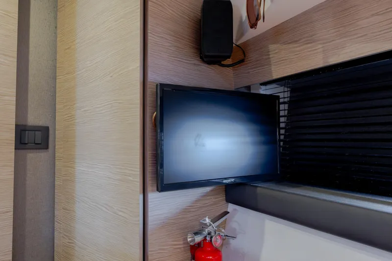 Slide: The Image of Interior of 2019 Azimut Verve 40 yacht with TV, speaker, and fire extinguisher. - 74