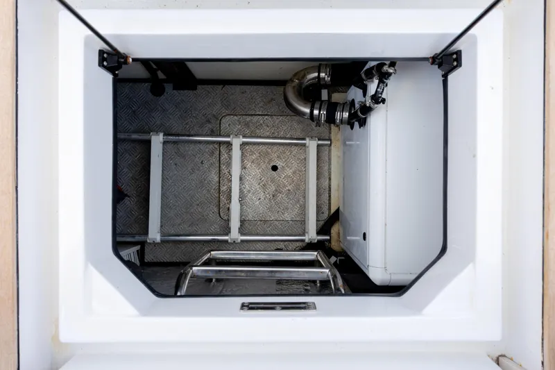 Slide: The Image of Engine compartment of 2019 Azimut Verve 40 yacht, featuring metal flooring and mechanical components. - 79