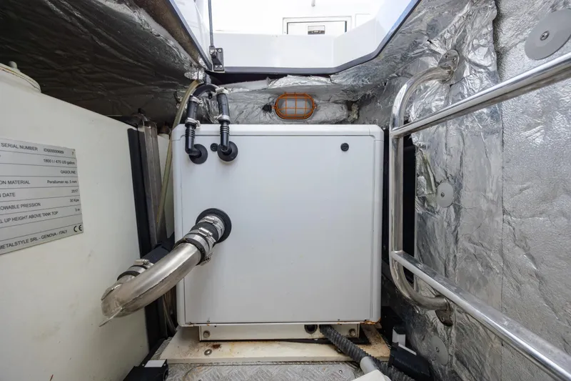 Slide: The Image of Engine room of 2019 Azimut Verve 40 yacht, featuring insulated walls and piping. - 80