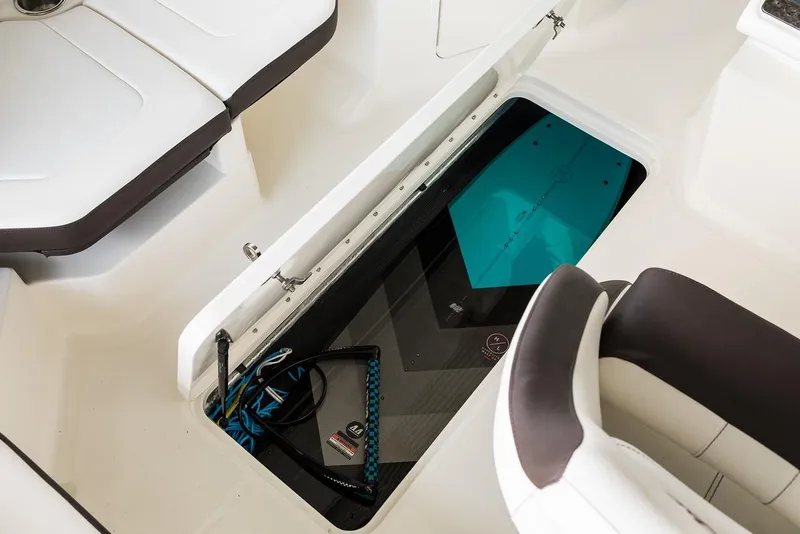 Slide: The Image of Manufacturer Provided Image: 2019 Sea Ray SPX 190 OB boat interior storage compartment with wakeboard and equipment. - 17
