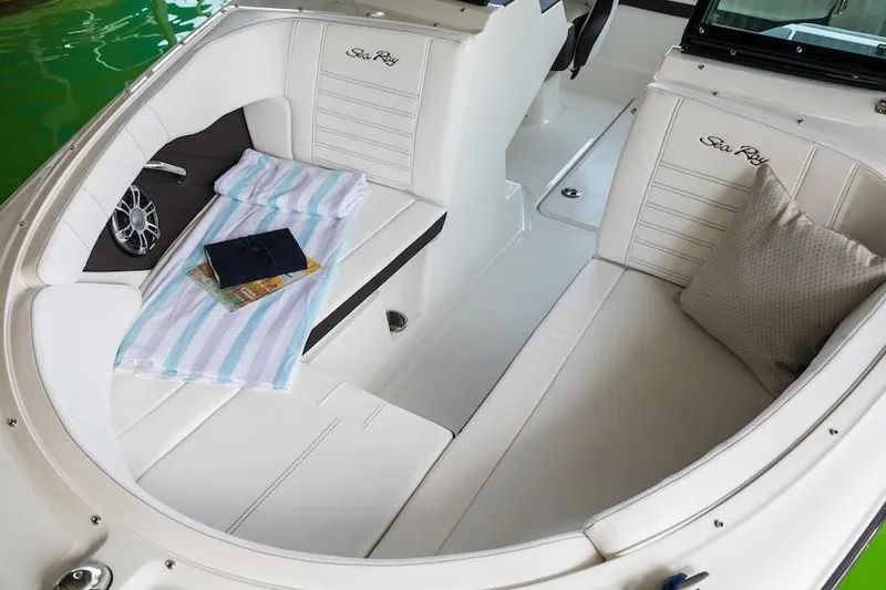 Slide: The Image of Manufacturer Provided Image: 2019 Sea Ray SPX 190 OB boat interior with white seating and accessories. - 9