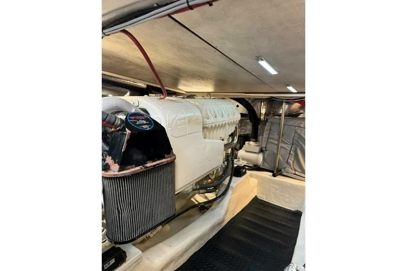 Slide: The Image of Engine room of 2002 Riviera 43 Open Flybridge yacht, showcasing a powerful engine setup. - 10