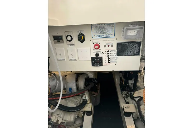 Slide: The Image of Control panel of 2002 Riviera 43 Open Flybridge engine room with various switches and indicators. - 11