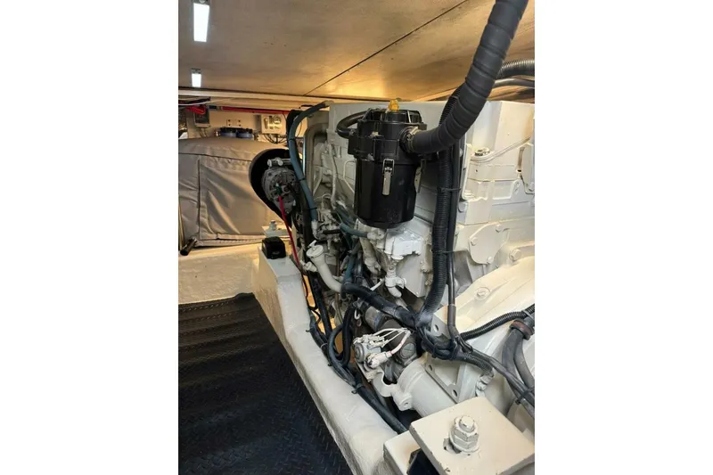Slide: The Image of Engine room of 2002 Riviera 43 Open Flybridge, showcasing detailed mechanical components. - 12