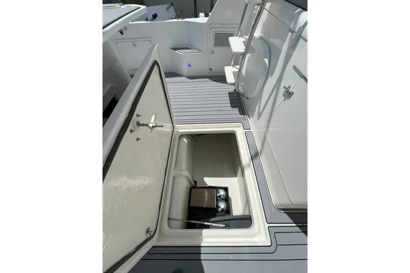 Slide: The Image of Open storage compartment on 2002 Riviera 43 Open Flybridge boat deck. - 15