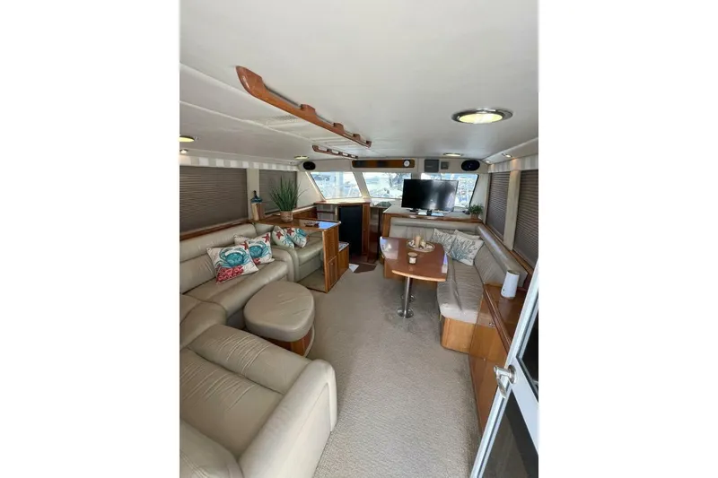Slide: The Image of Luxurious interior of 2002 Riviera 43 Open Flybridge yacht with plush seating and modern amenities. - 6