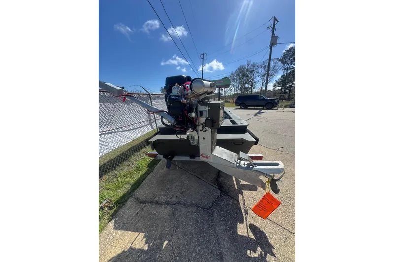 Slide: The Image of 2026 Go-Devil 16×54 boat on trailer, parked outdoors under clear sky. - 3