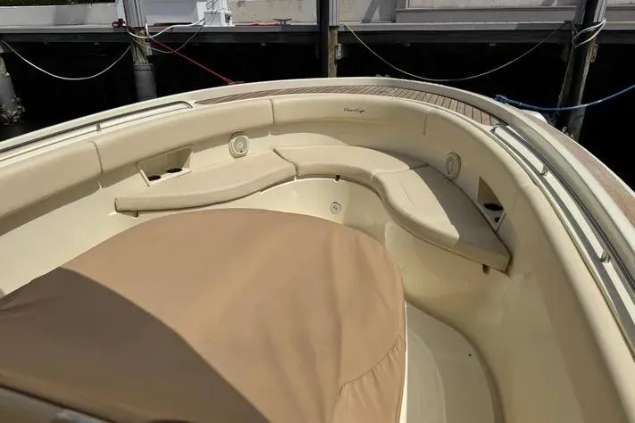 Slide: The Image of 2018 Chris-Craft Catalina 30 boat interior with beige seating and cover. - 20
