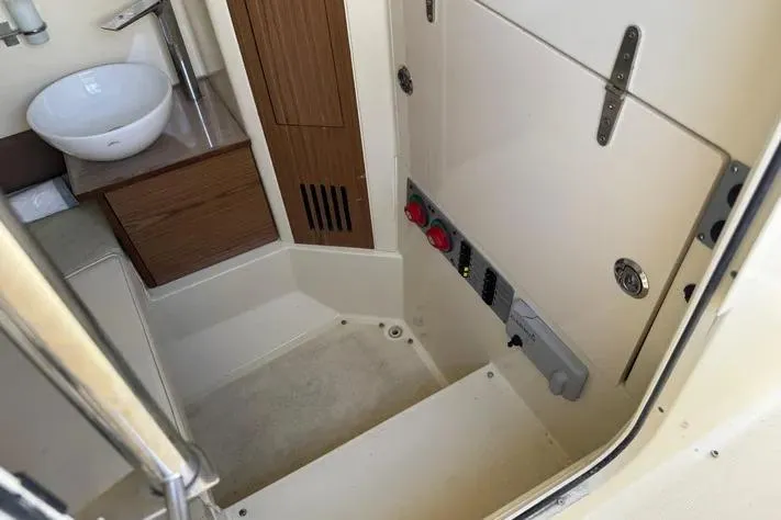 Slide: The Image of 2018 Chris-Craft Catalina 30 interior with sink and control panel. - 22