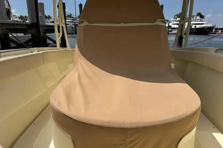 Slide: The Image of 2018 Chris-Craft Catalina 30 boat with covered seating, docked at marina. - 23