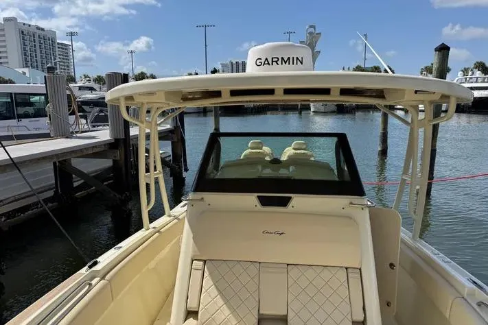 Slide: The Image of 2018 Chris-Craft Catalina 30 boat docked, featuring Garmin equipment and luxurious seating. - 27
